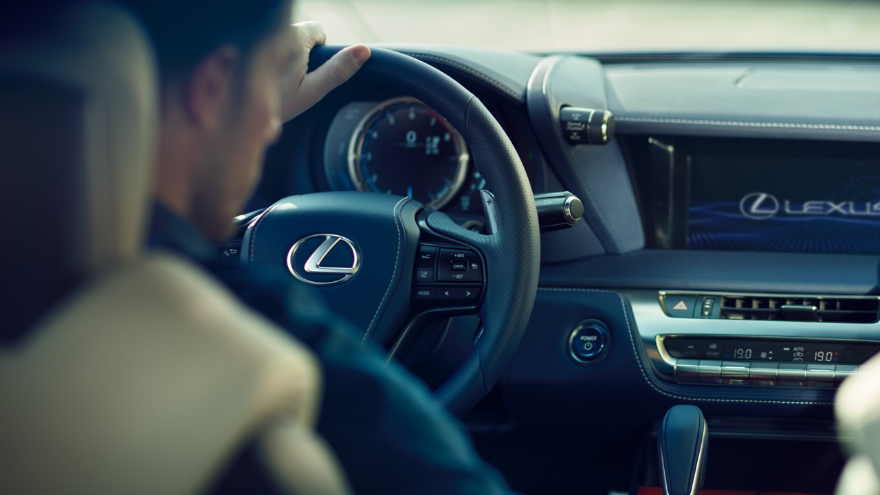 A Lexus mechanic running diagnostics