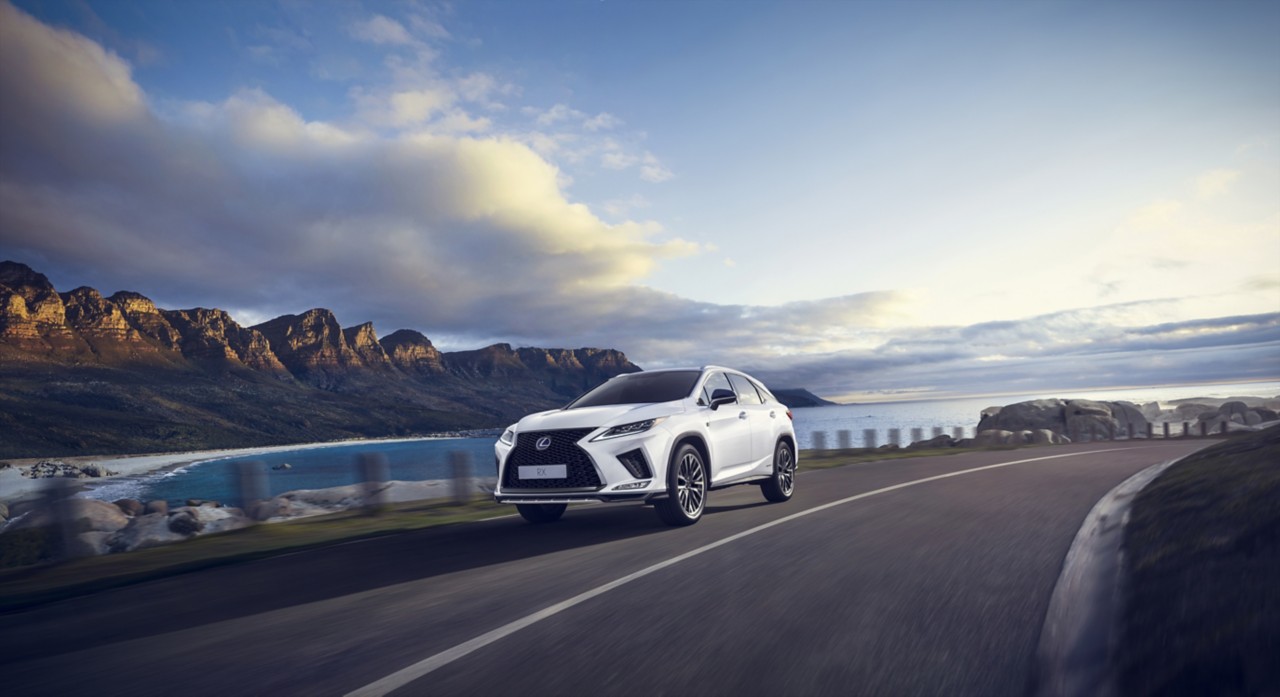 Lexus RX driving on a scenic road 