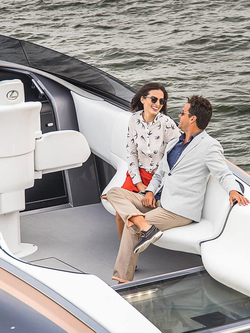 A man and woman sat on the Lexus Sports Yacht 