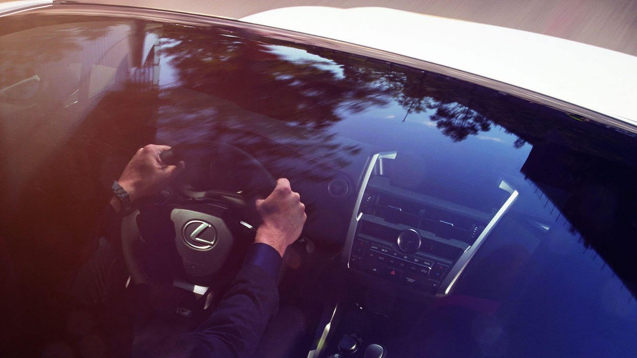 Interior view of a Lexus through a sunroof 