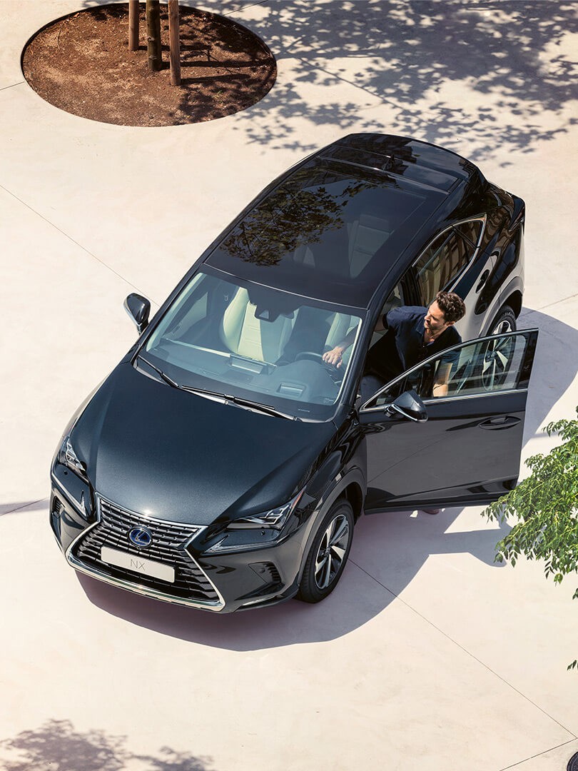 A man exiting a Lexus NX 
