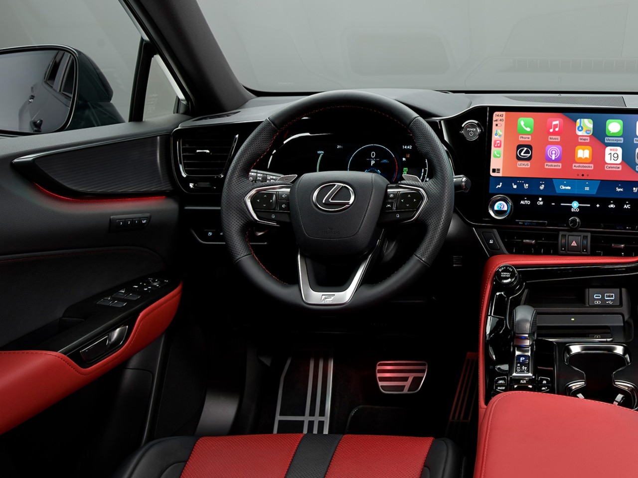 A man sat in a Lexus NX